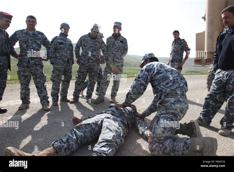 The Iraqi Police Conduct First Aid Training On How To Check A Casualty