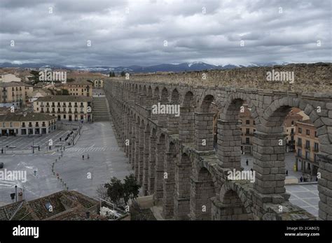 Aerial view of the magnificent Aqueduct of Segovia captured on a cloudy ...