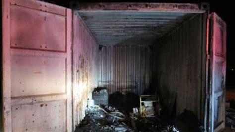 Mystery Surrounds Charred Corpses Found In Container