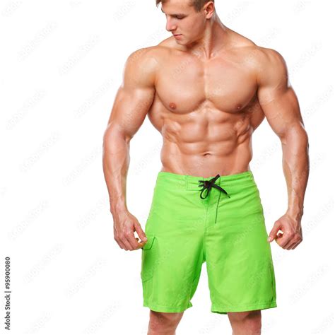 Sexy Athletic Man Showing Abdominal Muscles Without Fat Isolated Over