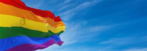 Gay Pride Flag Waving In The Wind At Cloudy Sky Freedom And Love