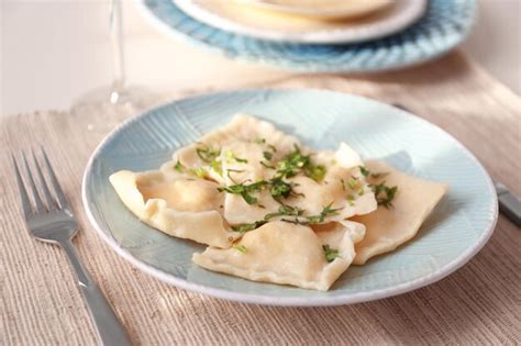 Premium Photo Plate With Delicious Ravioli On Table