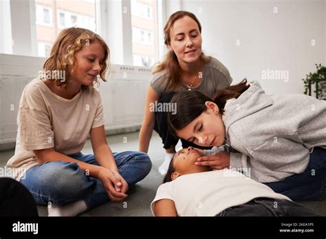 Teacher Giving First Aid Training Stock Photo Alamy