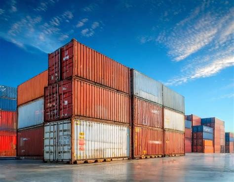 Premium Photo Stacked Shipping Containers At A Busy Cargo Port During