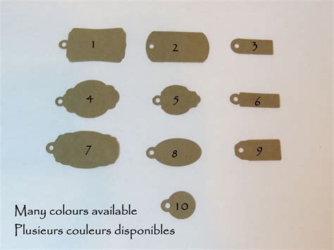 Some Brown Paper Tags And Numbers On A White Surface With The Words