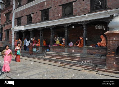 Sadhus And Devotees Perform Rituals At Pashupatinath Hindu Temple A