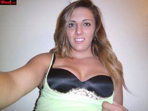 Brunette Hottie Showing Off Her Nice Ass In Booty Shorts Photos