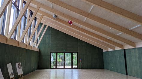 Modern Community Centre Wraps Around A Century Old Lodge