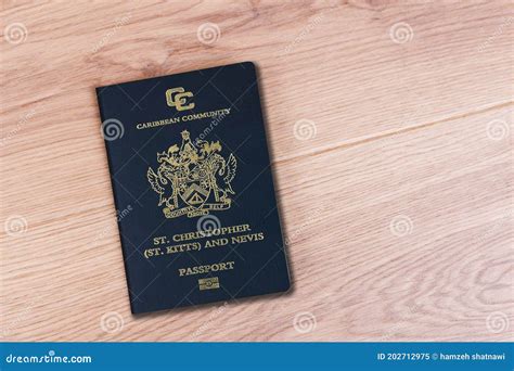 Top View Of Saint Kitts And Nevis Passport On Wooden Desktop Editorial