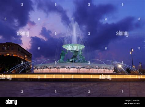 The Triton Fountain Illuminated By Night In Valletta Malta Stock Photo