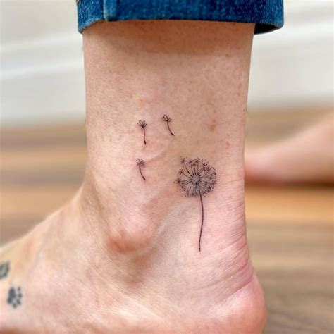 Fine Line Style Dandelion Tattoo Located On The Ankle