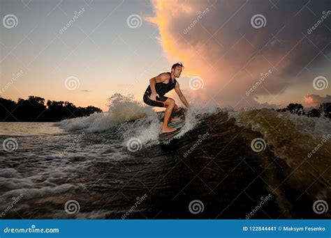 Handsome Young Man Wakesurfing Down The River Waves Stock Image Image