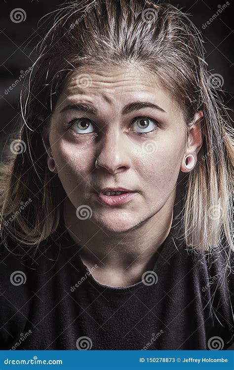 Determined Facial Expression Of Young Woman Powerlifting In Connecticut