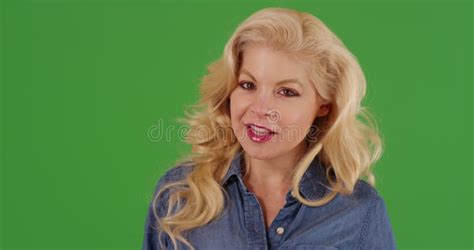 Close Up Of Attractive Blonde Woman Looking Around Smiling On Green