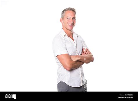 Portrait Of Confident Mature Man Standing On White Background Stock