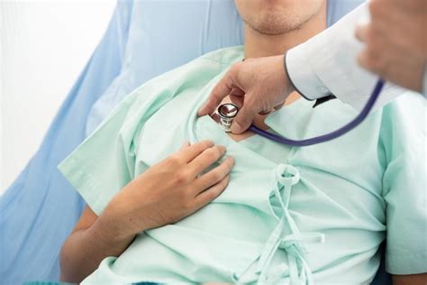 Premium Photo Cropped Hands Of Doctor Examining Patient In Hospital