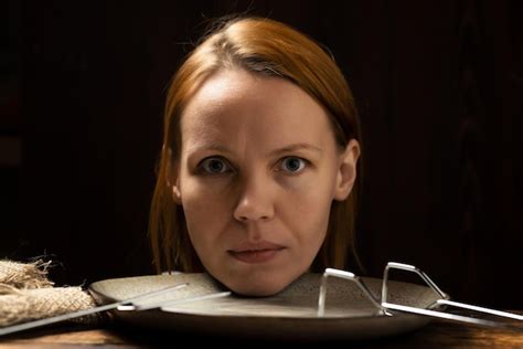 Premium Photo Female Head On A Plate On A Dark Background Fear Of