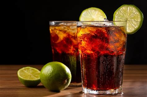 Premium Photo Cola Soda Glasses With Ice Cubes And Lemon