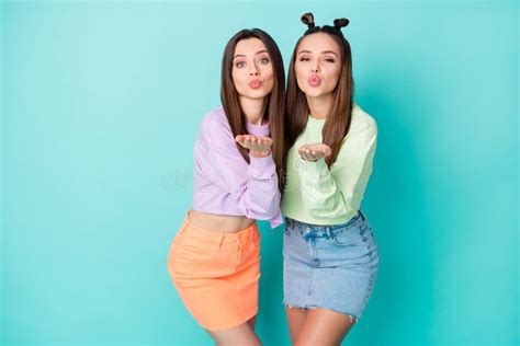 Two Girls On The Bed Sending Air Kiss Stock Photo Image Of Movement