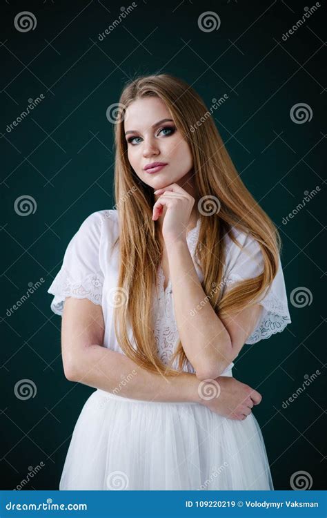 Young Woman In White Dress Posing By The Background Stock Image Image