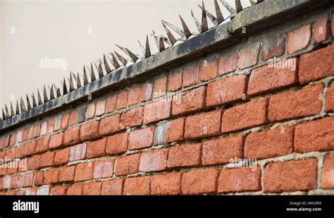 A Close Up Of Metal Spikes On Top Of A Brick Wall In Hartlepoolengland