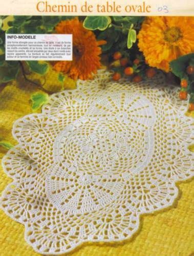 The Crochet Doily Pattern Is Shown In White And Has Flowers On It