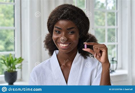 Young Pretty Happy Smiling Black Girl Holding Beauty Pill Headshot