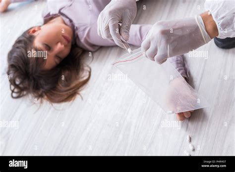 Forensic Investigator At The Crime Scene Investigating Woman Mur Stock
