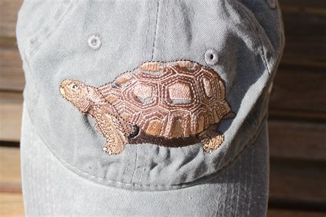 A Turtle Tortoise Is Embroidered On A Baseball Hat Cap Adjustable Hat