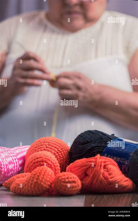 Elderly Woman 60 Year Old Latin Grandmother Knitting Happy And