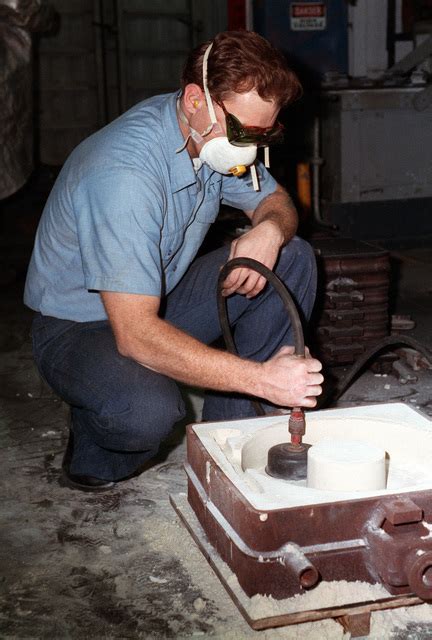 Molder 1ST Class Deem E Ott Prepares A Mold For Molten Steel Aboard