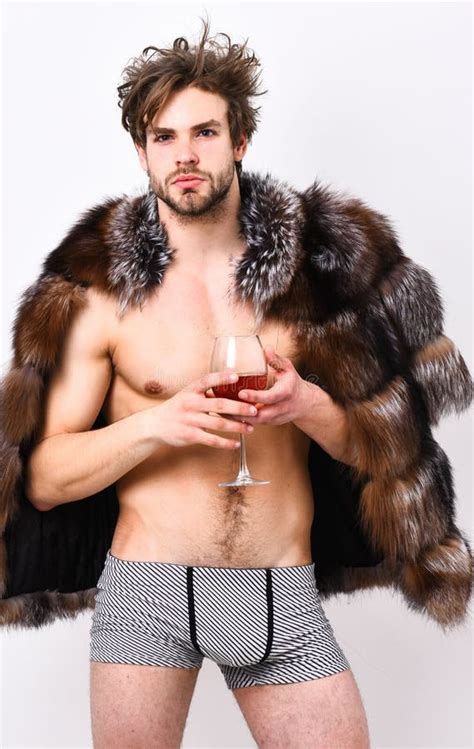 Richness And Luxury Concept Guy Attractive Rich Posing Fur Coat On Naked Body Rich Athlete