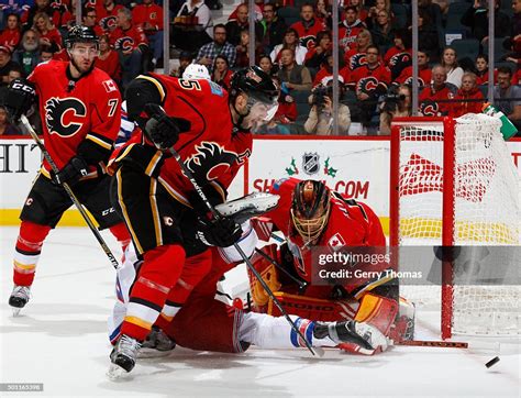 Jonas Hiller Of The Calgary Flames Makes A Save Against The New York