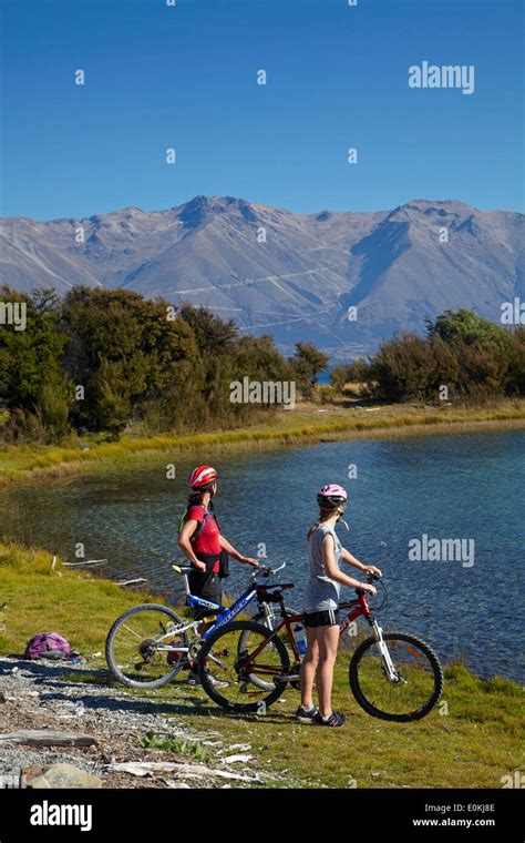 Cyclists On Alps 2 Ocean Cycle Trail By Lake Ohau And Ohau Range