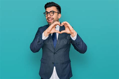 Hispanic Man With Beard Wearing Business Suit And Tie Smiling In Love