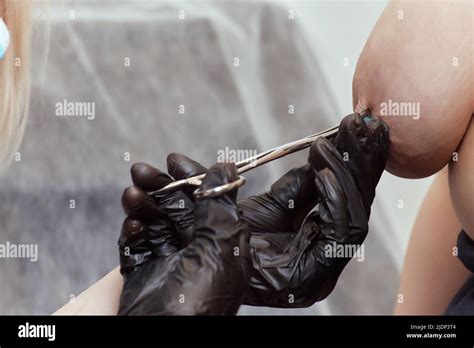 Nipple Piercing Procedure For Women Close Up Of A Nude Breast Stock Photo Alamy