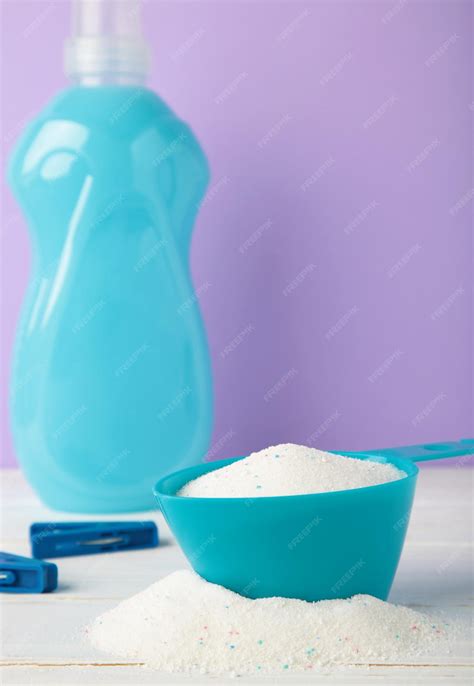Premium Photo | Laundry detergents with washing powder on purple
