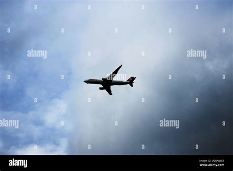 Big Plane Flying In The Cloudy Sky Stock Photo Alamy