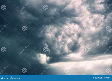 Very Dark Storm Clouds with Yellow Sky Peeking through Stock Image ...