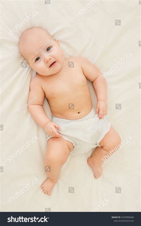 Naked Cute Baby Girl On Light Stock Photo 1670989606 Shutterstock