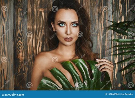 Portrait Of Naked And Brunette Girl With Amazing Blue Eyes Stock Photo