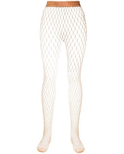 Wolford X Amina Muaddi Crystal Embellished Net Tights In Brown Stylemi