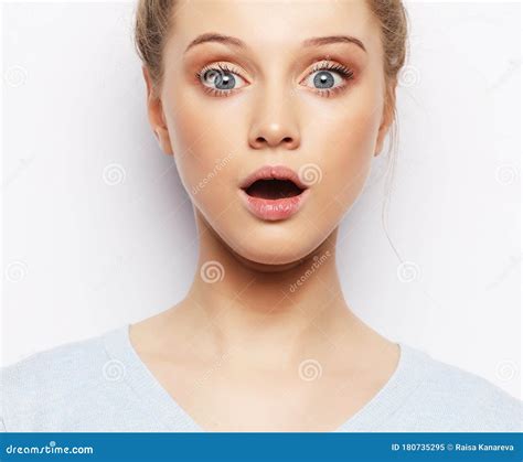 Indoor Shot Of Stupefied Shocked Blonde Woman Keeps Mouth Widely Opened Looks At Camera Stock