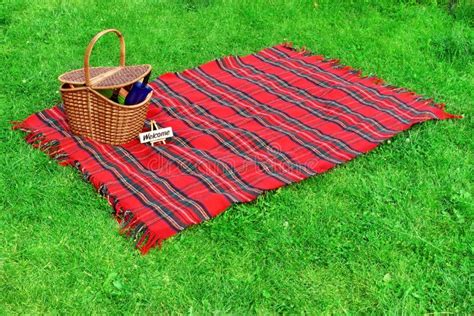 Picnic Blanket And Basket On The Lawn Stock Photo - Image: 43768780