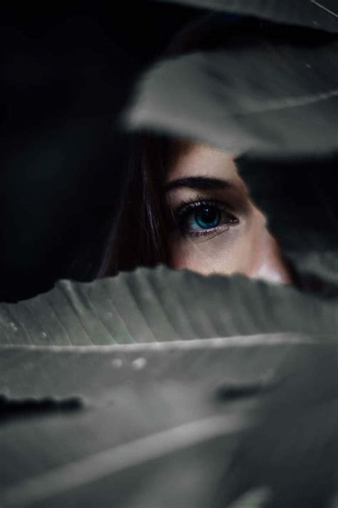 Download Hidden Woman In Leaves Wallpaper | Wallpapers.com 