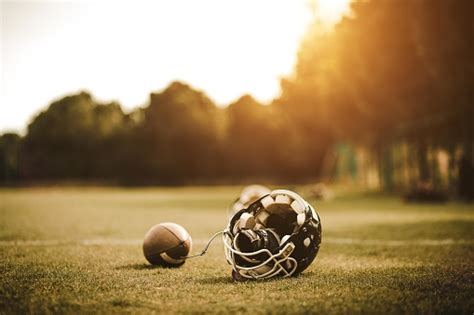 Football Helmet On Field And Ball Stock Photo Download Image Now Istock