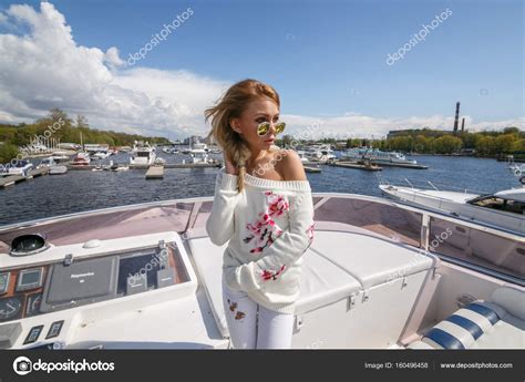 Blonde Girl Standing On Yacht Stock Photo Schummyone
