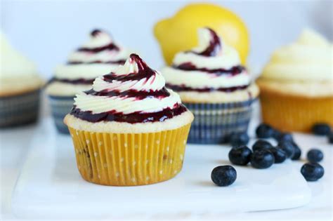 Blueberry Cupcakes With Lemon Buttercream Frosting And Blueberry Sauce