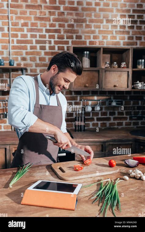 Happy Young Man Cooking With Tablet Stock Photo Alamy