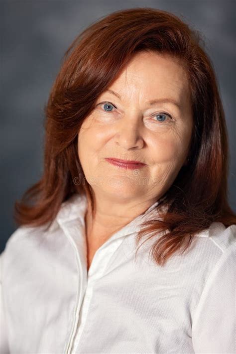 European Mature Woman Feels Unhappy Touching Chin In Living Room Stock Photo Image Of Woman